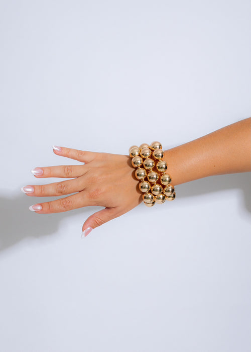 Shimmering gold bracelet set perfect for a stylish night out look