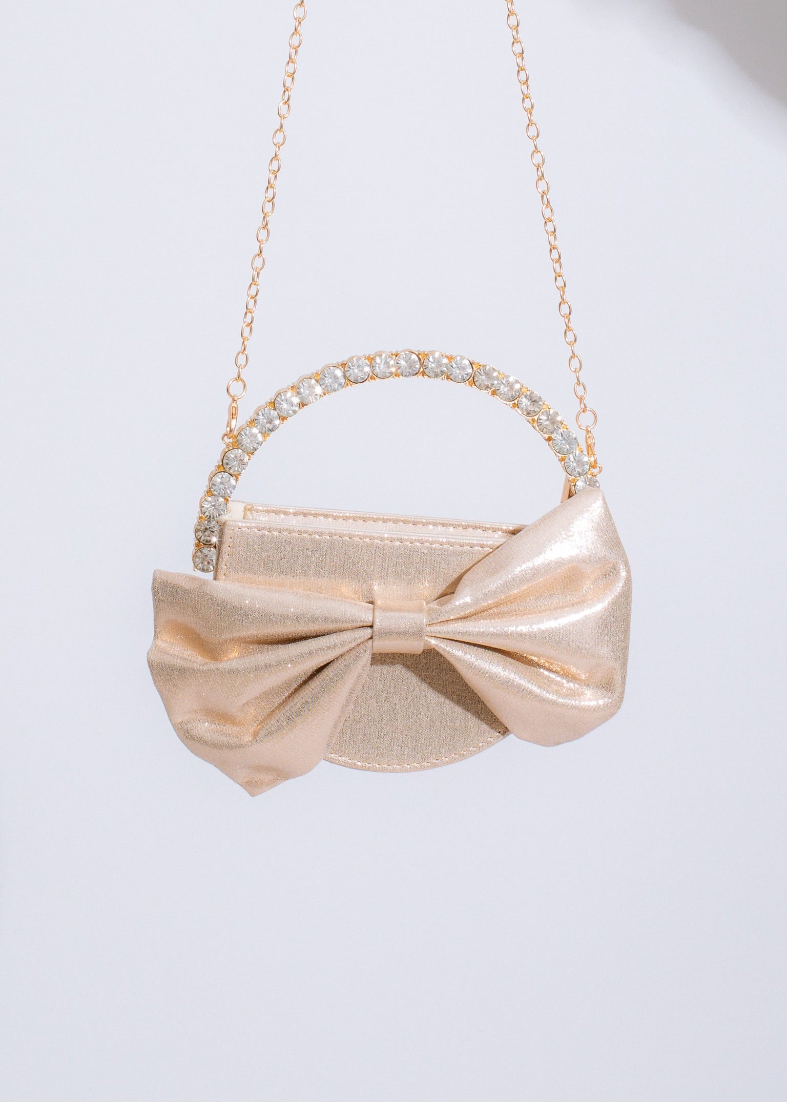 Chic and stylish Sweetest Girl Bow Handbag Gold featuring a timeless bow design and shimmering gold finish for a touch of glamour