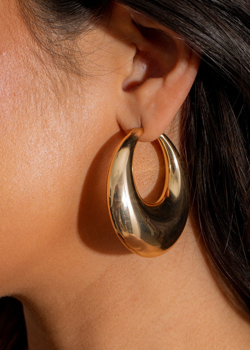 Shimmering gold hoop earrings with a unique design perfect for weekend vibes and casual outings