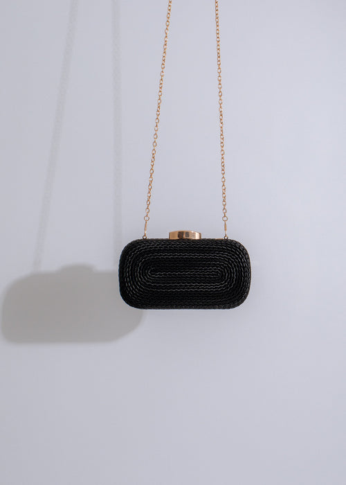 Luxurious black leather crescent-shaped clutch with elegant gold accents