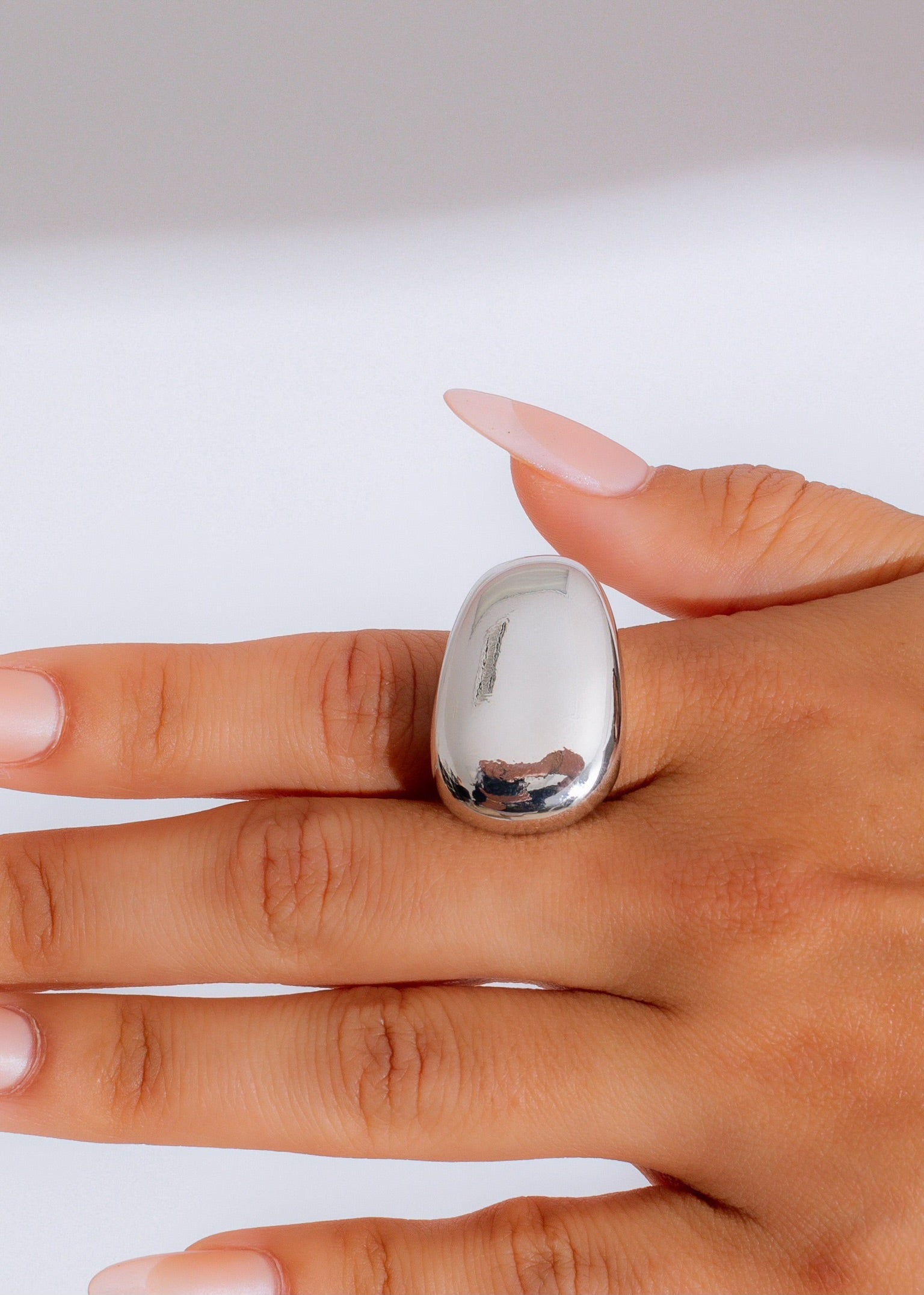 Eclipse Dome Ring Silver, a stunning sterling silver ring with a sleek and modern design, perfect for adding a touch of elegance to any outfit