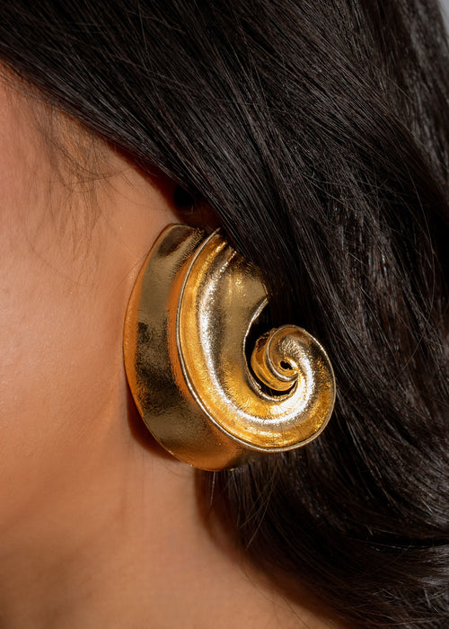 Shiny gold nautilus earring with intricate spiral design and polished finish