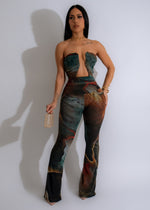Close-up of brown mesh jumpsuit with flared sleeves and v-neckline
