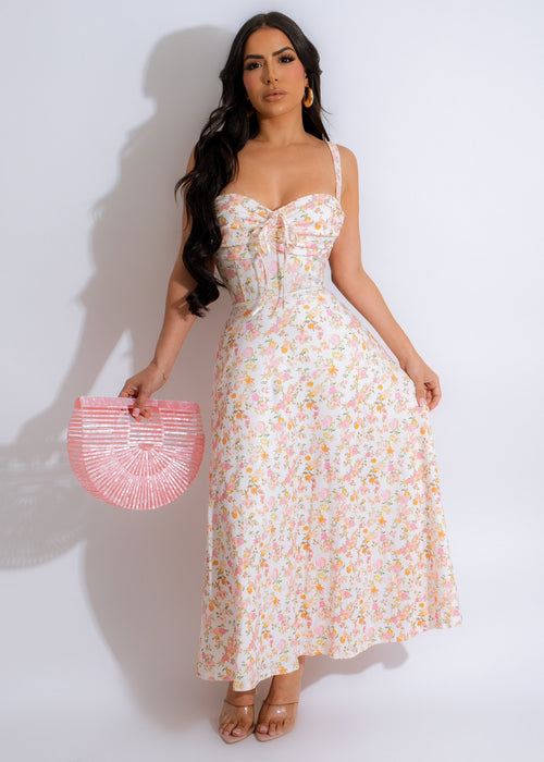 Pastel floral midi dress in white with a delicate floral pattern and a flattering midi length silhouette