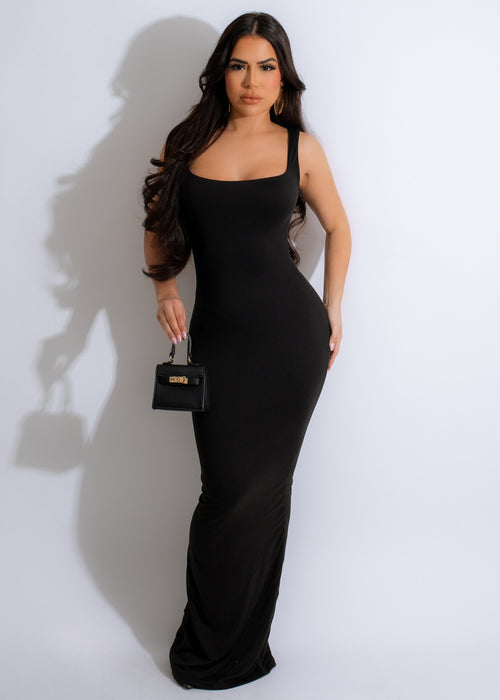 An Illusion Maxi Dress Black, a floor-length evening gown with illusion neckline and sheer sleeves, perfect for formal events and parties