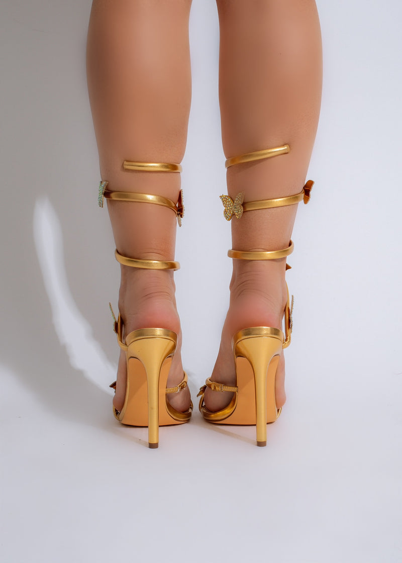  Fashionable and glamorous gold heels adorned with sparkling rhinestones