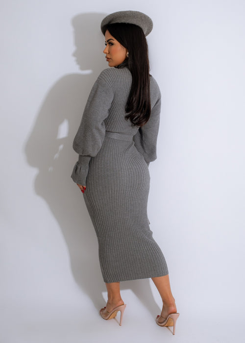  Woman wearing grey ribbed sweater midi dress with a relaxed fit, ideal for a cozy day out or lounging at home