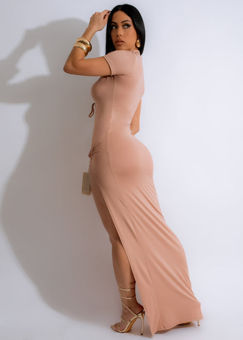 Elegant and flowy nude dress featuring a flattering V-neck and open back design
###