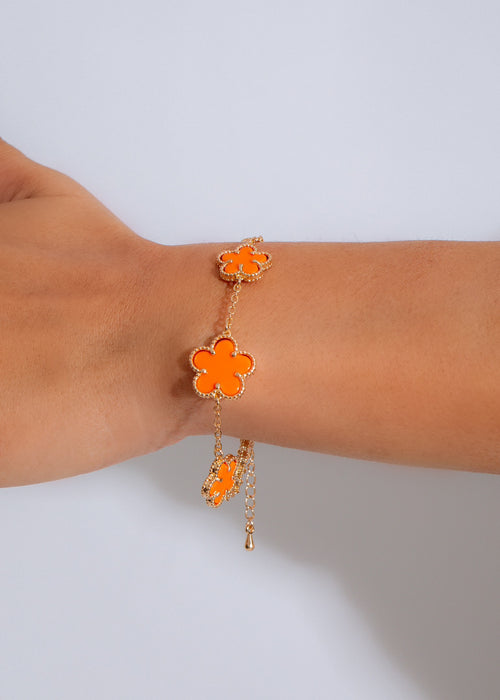 Be My Forever Bracelet Orange on a woman's wrist, showcasing its vibrant color and elegant design