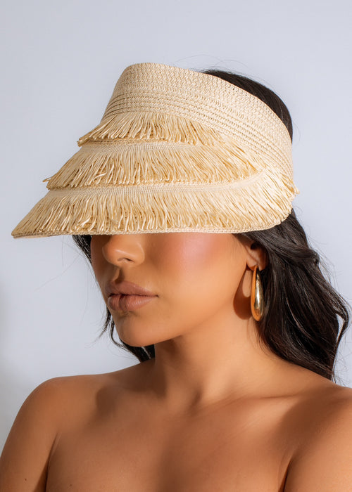 Close-up of nude summer visor hat with postcard design and oversized brim 