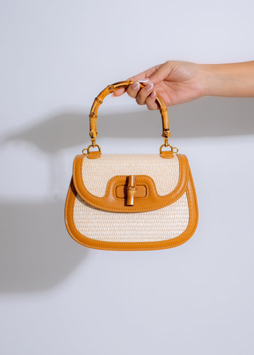 Stylish and versatile nude handbag with spacious interior and adjustable strap