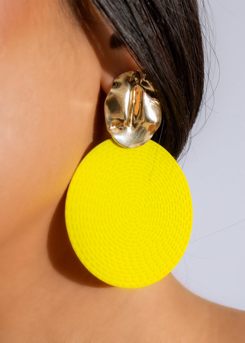 Handmade yellow statement earrings, perfect for adding a pop of color to your vacation outfit