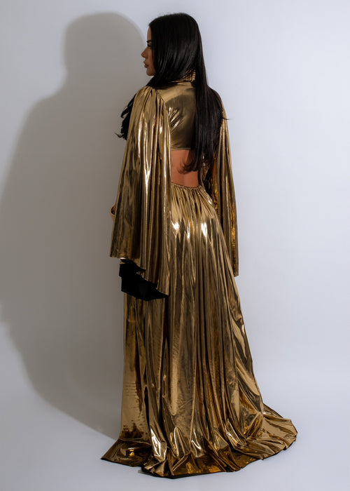 Gorgeous and glamorous, the Portrait Of Our Love Metallic Maxi Dress Gold is a show-stopping gown featuring a metallic gold color, a flowing maxi length, and a figure-enhancing fit