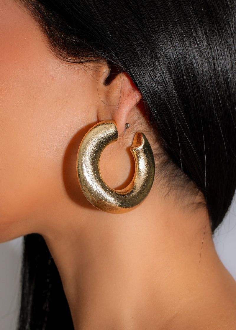 Shiny gold hoop earrings with intricate design, the Pretty Perfect Earring Gold