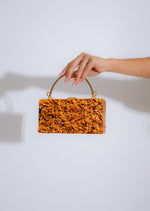 My Distraction Handbag Orange, a stylish and spacious carry-all accessory for everyday use, featuring a vibrant orange color and durable construction 