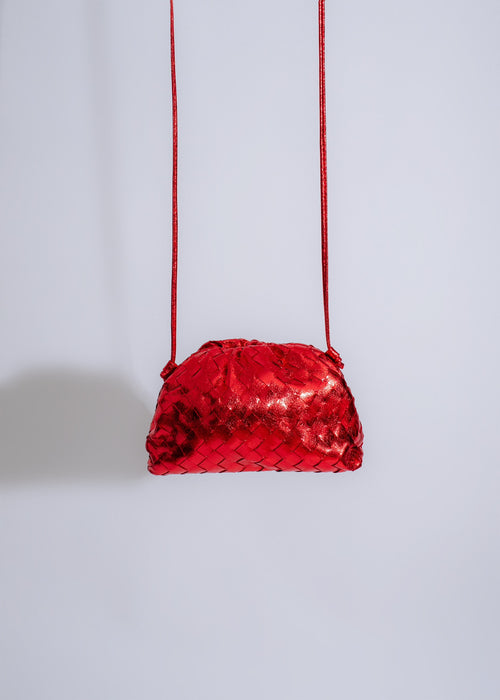Gorgeous red metallic handbag with shimmering details and irresistible appeal