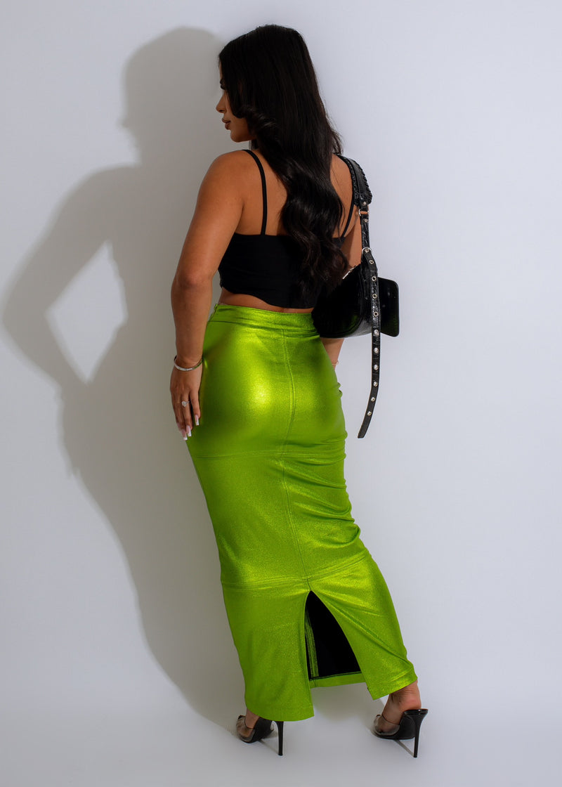 A woman walking confidently in the Affirmative Action Metallic Skirt Green outfit