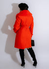 Stylish and bold orange fur coat for women, perfect for making a statement