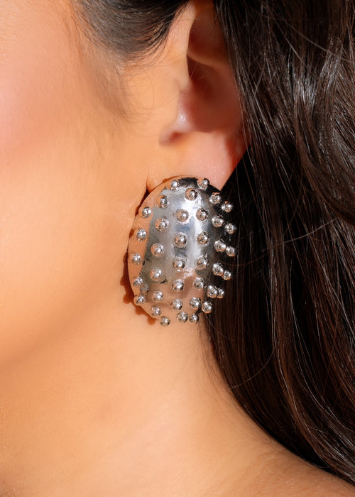 Silver earrings with edgy design and intricate detailing for bold, confident women