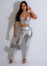 A silver faux leather crop top with a hard as a rock texture