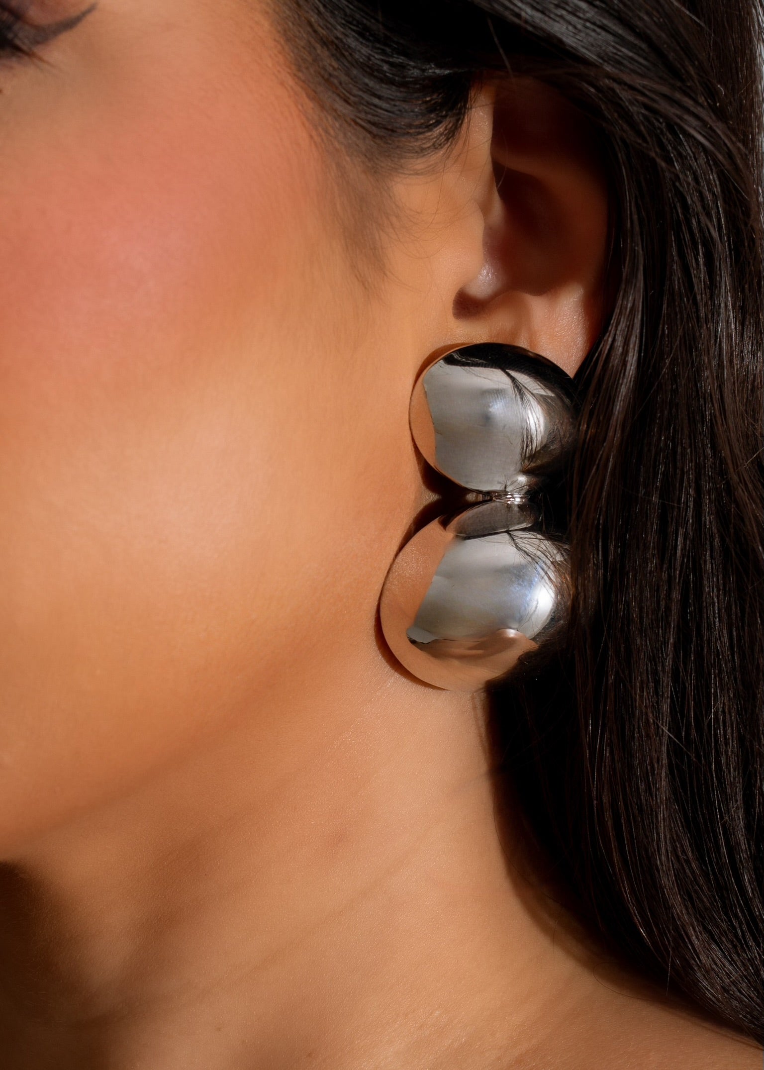 Beautiful silver No Regrets earring featuring a unique and timeless design