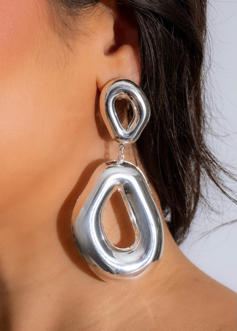 Silver earring with intricate design and geometric shape from Curious About U collection