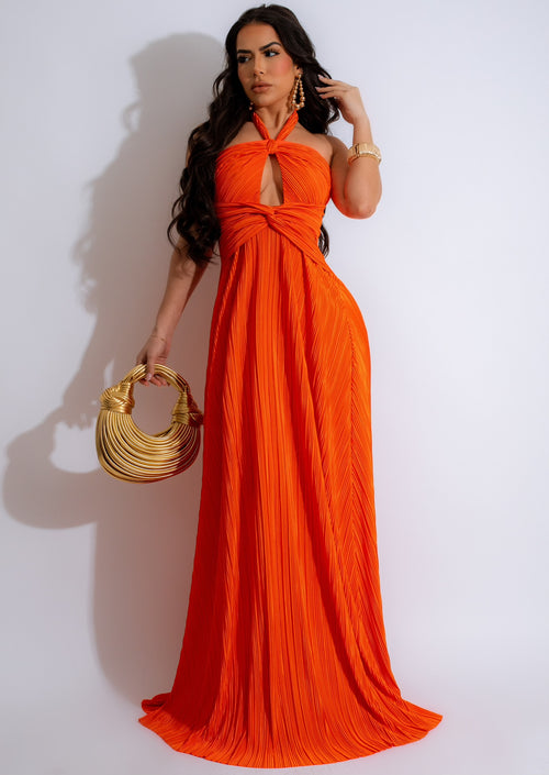 Shimmering orange silk maxi dress with elegant flowing hemline