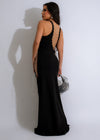 Side view of the Mystery Maxi Dress Black, showcasing the flowy silhouette
