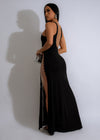 Back view of the Mystery Maxi Dress Black, featuring a keyhole cutout and tie closure