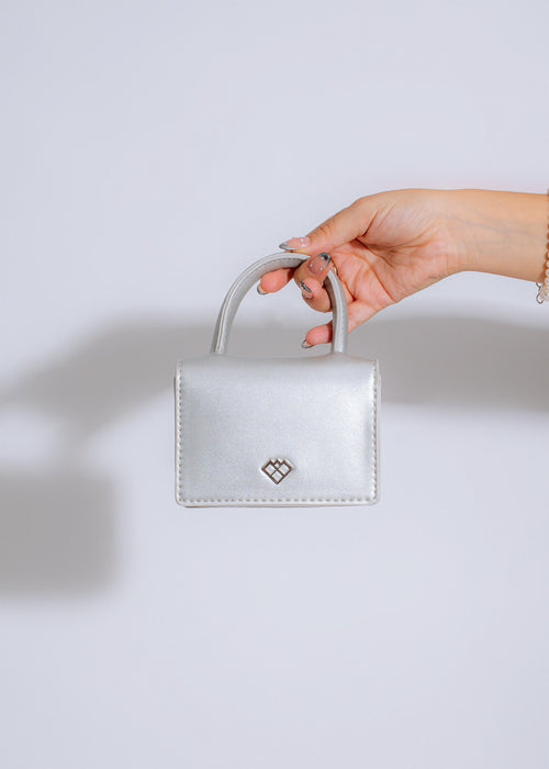 
Chic and glamorous Cannes Festival Bow Handbag in Silver, a stunning statement piece with a unique bow design, perfect for adding a touch of luxury to any outfit
