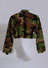 High-quality image of My Favorite Crop Camo Jacket Green folded and styled with other accessories
