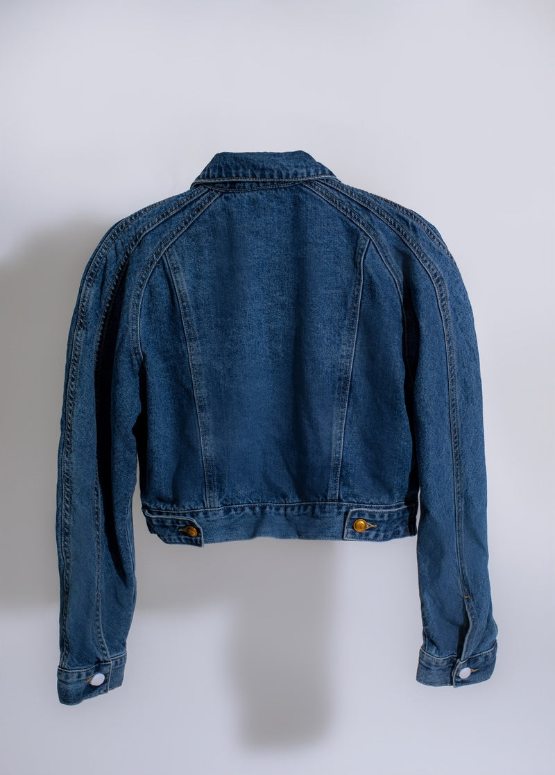 Denim jacket adorned with romantic embellishments and intricate stitching details