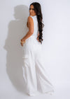  Gorgeous female model in a trendy off-white jumpsuit with cargo-style details