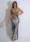 Shimmering silver sequin maxi dress with flowing skirt and plunging neckline