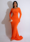  Elegant lady posing in a fashion-forward Euphoric Girl Ruched Maxi Dress Orange, perfect for summer events