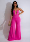 Sweet Treat Jumpsuit Pink, a stylish and comfortable one-piece outfit for women with a pink floral print and adjustable shoulder straps