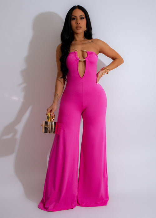Sweet Treat Jumpsuit Pink, a stylish and comfortable one-piece outfit for women with a pink floral print and adjustable shoulder straps