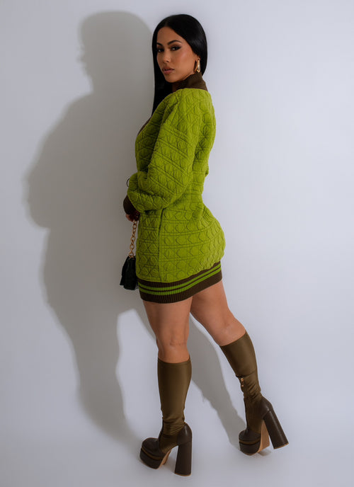  Elevate your wardrobe with the Bitter Sweet Sweater Mini Dress Green, a versatile and chic knit dress perfect for layering and accessorizing in colder temperatures