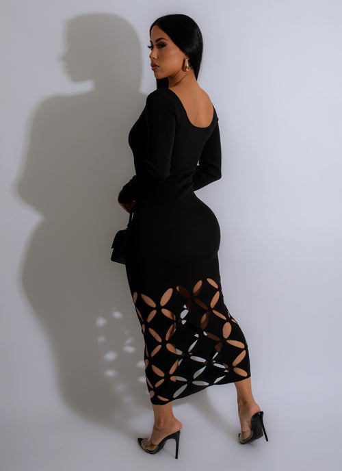 Black sweater midi dress with a slender body design for a sleek and elegant look
