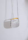 An elegant and eye-catching silver handbag adorned with sparkling gemstones and a chic metallic finish
###