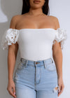  Close-up of Sweet Dream Ribbed Crop Top White, showcasing the high-quality ribbed fabric and the trendy cropped length for a fashionable look