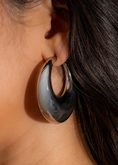 Shiny silver earrings with a relaxed weekend vibe, perfect for casual wear