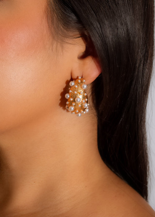 A close-up image of a pair of exquisite Oh So Fancy Earrings made with sparkling crystals and intricate metalwork, perfect for adding a touch of elegance to any outfit