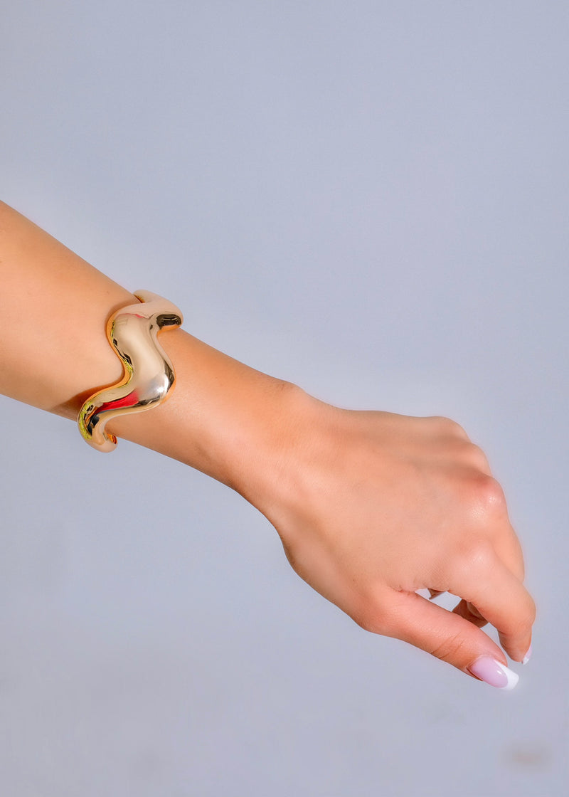 A stunning gold bracelet with a unique design, the That's My Type Bracelet is the perfect accessory to elevate any outfit