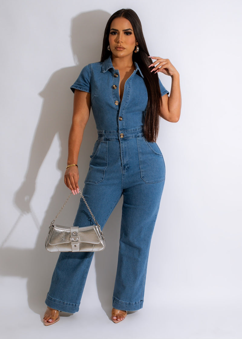 Blue denim jumpsuit with button-up front and tie waist detail