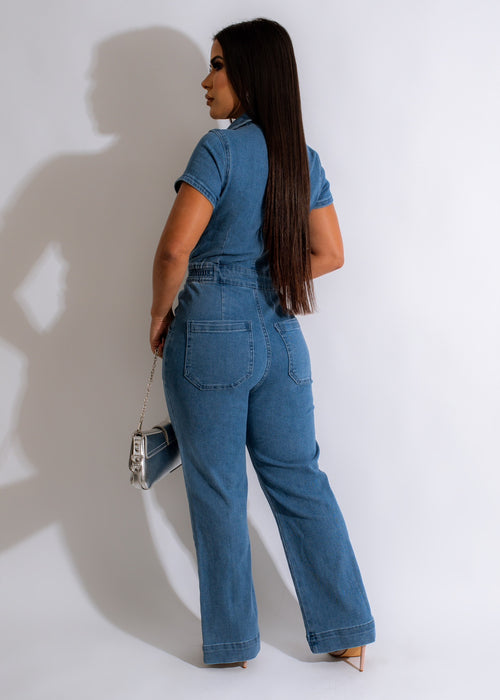 An image of a stylish Say Nothing Denim Jumpsuit, featuring flared legs and a flattering waist tie