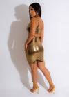 Shimmering gold metallic mini dress with a sun-kissed glow, perfect for a night out