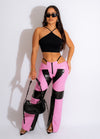 The Idol Faux Leather Pant Pink showcased on a model walking down the street in a stylish and trendy fashion outfit
