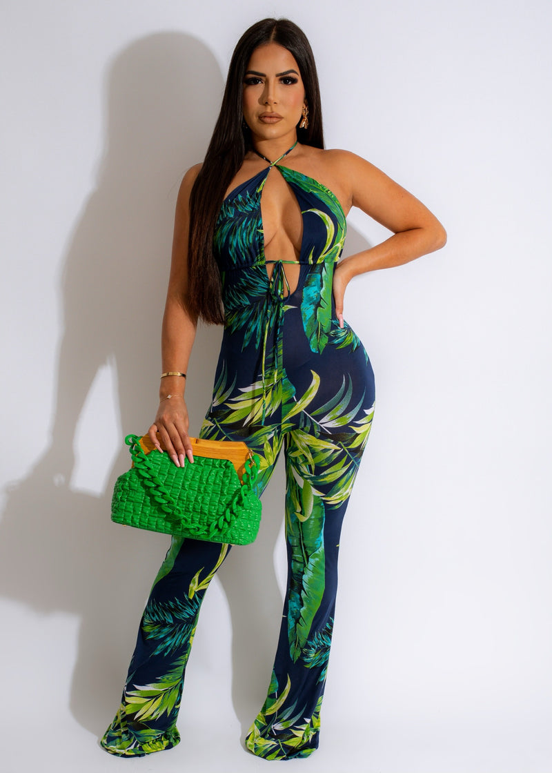 Stunning and vibrant Colors Of The Wind Jumpsuit featuring a flowing, wide-leg design and bohemian-inspired print with shades of blue, green, and yellow