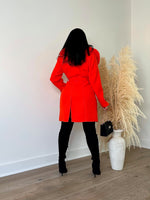 Stylish and bold orange fur coat for women, perfect for making a powerful fashion statement